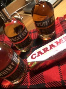 Whisky samples and a Caramel Wafer on a tartan background