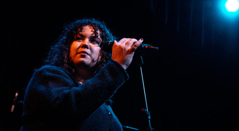 Singer performing on stage from the band Foreign Film club
