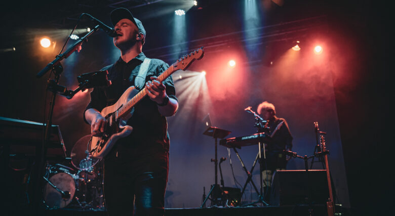 Musicians from duo So Called Friends performing on stage.